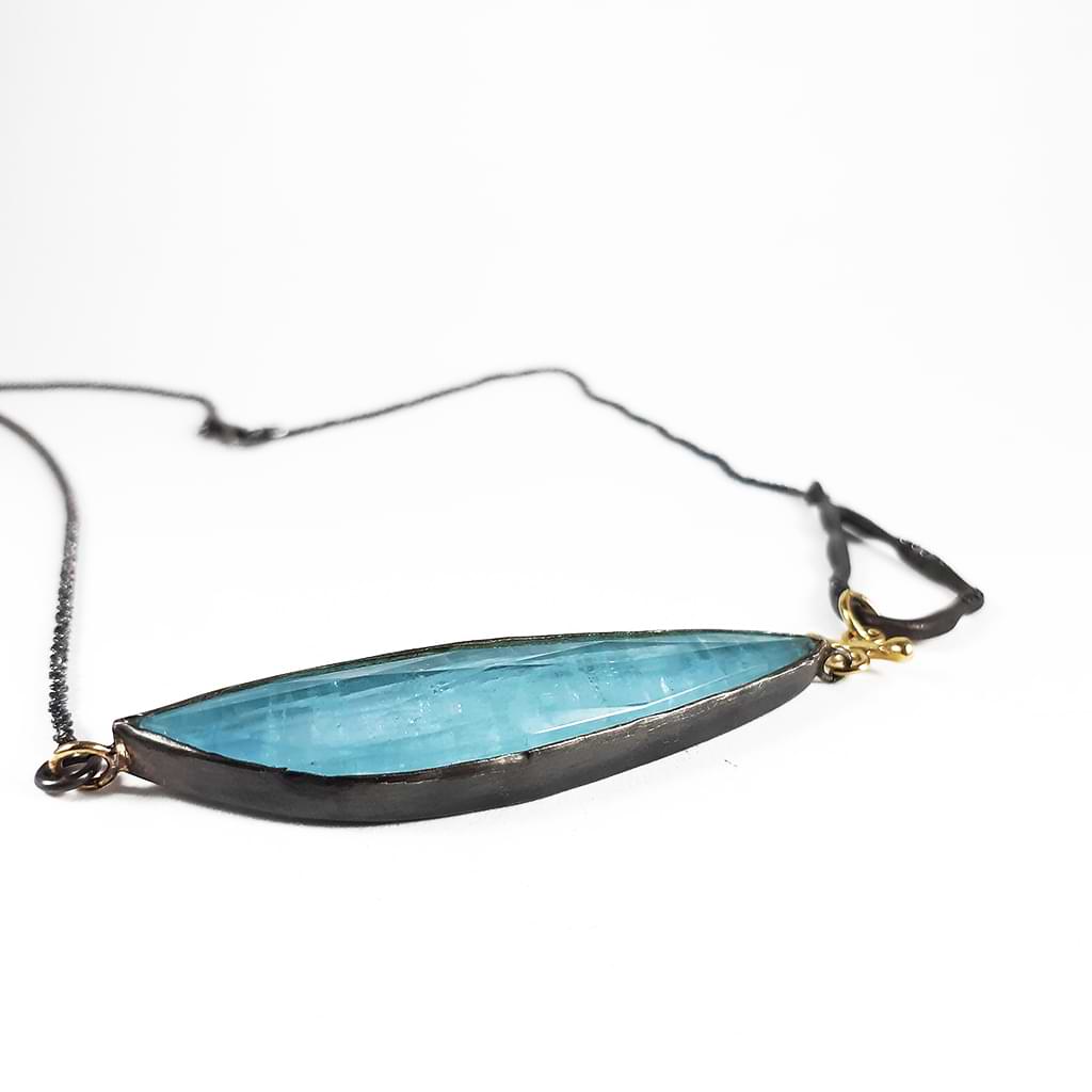 Unique necklace with Aquamarine, silver, gold and diamonds. Side view