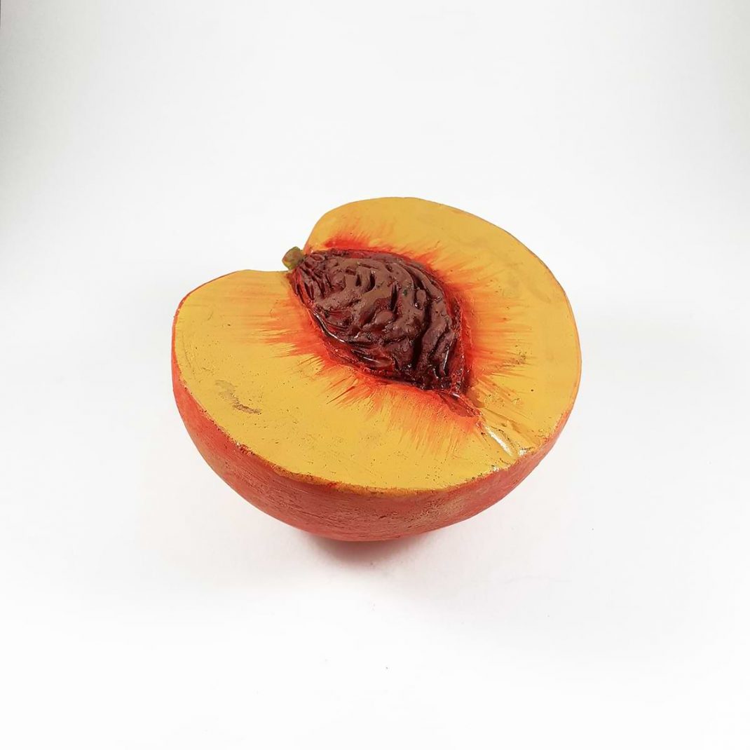 Nikolas Bliatkas. Ceramic fruit-peach cut in half with stoneware clay baked at 1080 C and painted with acrylic paints. 