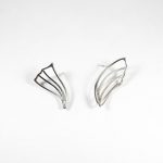 Niki Boli. Silver dissimilar earrings designed with simple elegance.