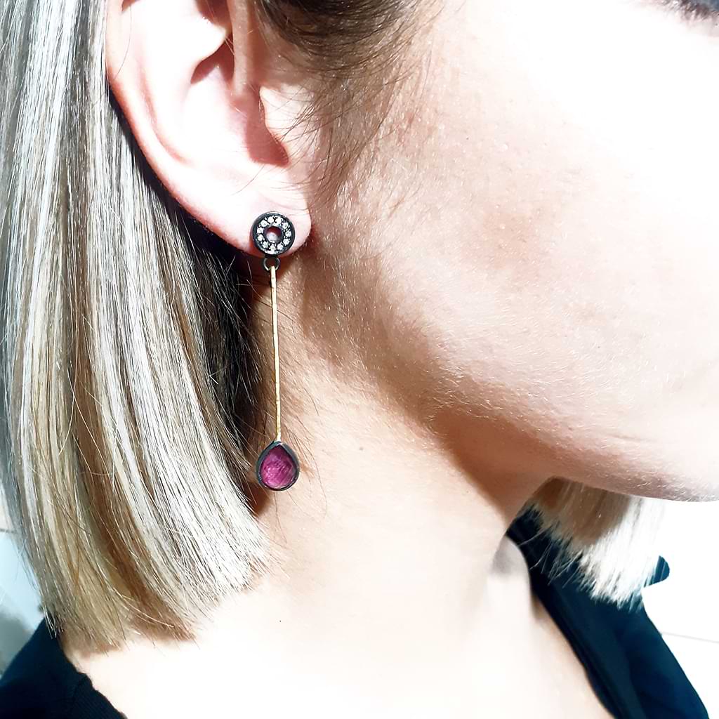 Niki Boli. Long double earrings with ruby. Worn in the ear