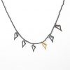 Niki Boli. Necklace with Hematites, gold and five silver hearts