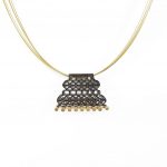 Silver necklace with geometric patterns, gold plated and oxidized on steel wires.