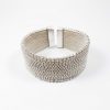 Myrsini Bezourgianni. Wide bracelet made of silver braided by hand with the special maltesing technique