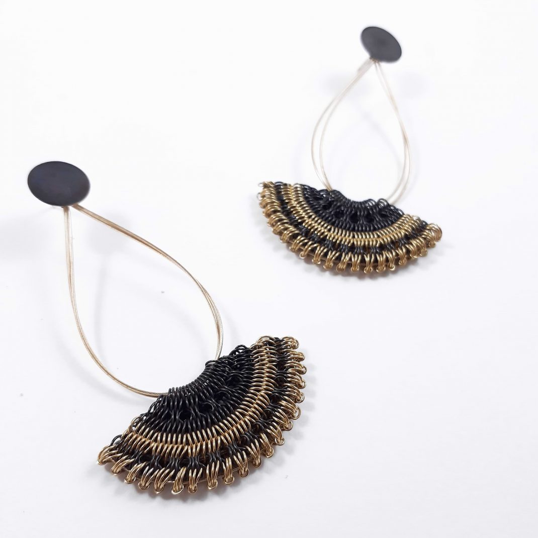 Myrsini Bezourgianni. Earrings made of silver braided by hand in the shape of a fan and maltesing technique with oxidation and gilding.