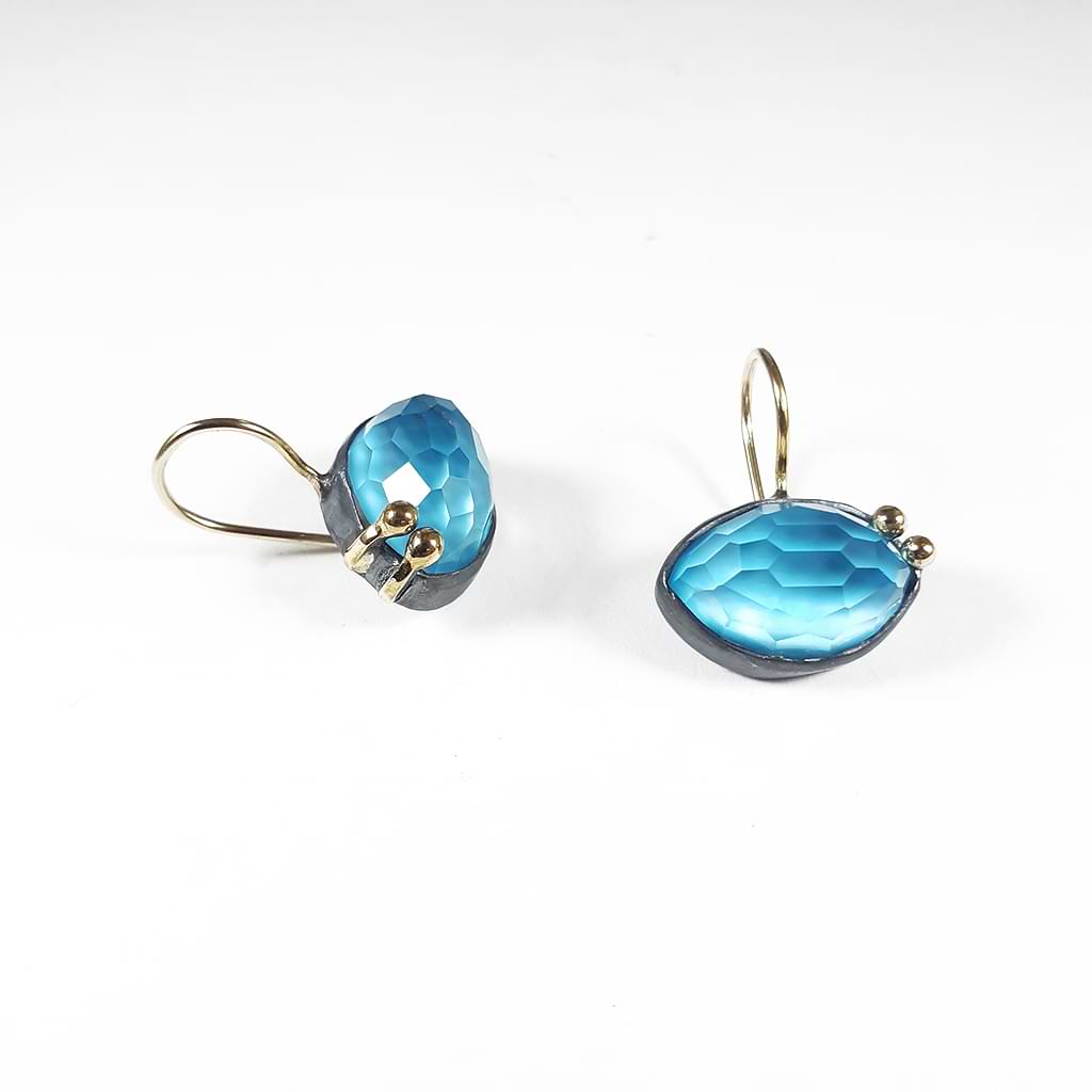 Bright turquoise & crystal doublet earrings, encircled with blackened silver & gold elements.