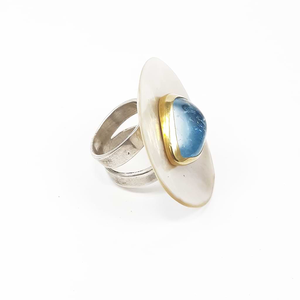Katerina Malami. Ring with Blue Topaz on a shell. Side view