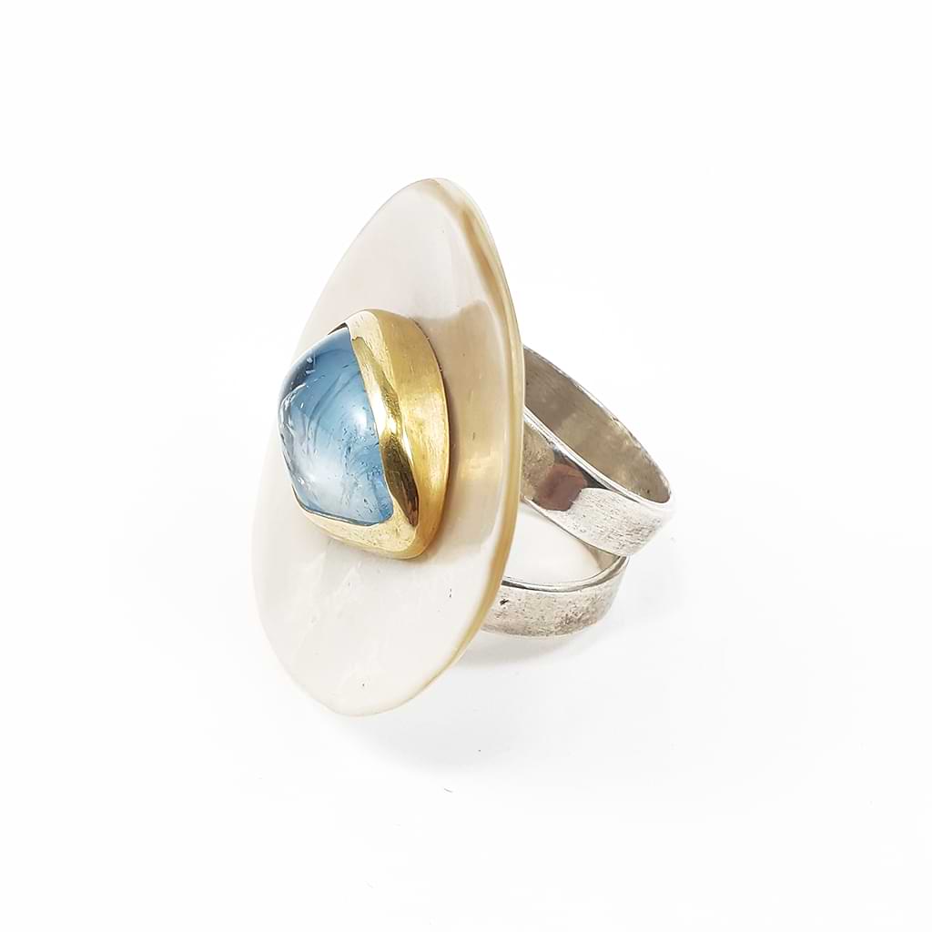 Katerina Malami. Ring with Blue Topaz on a shell. right side view