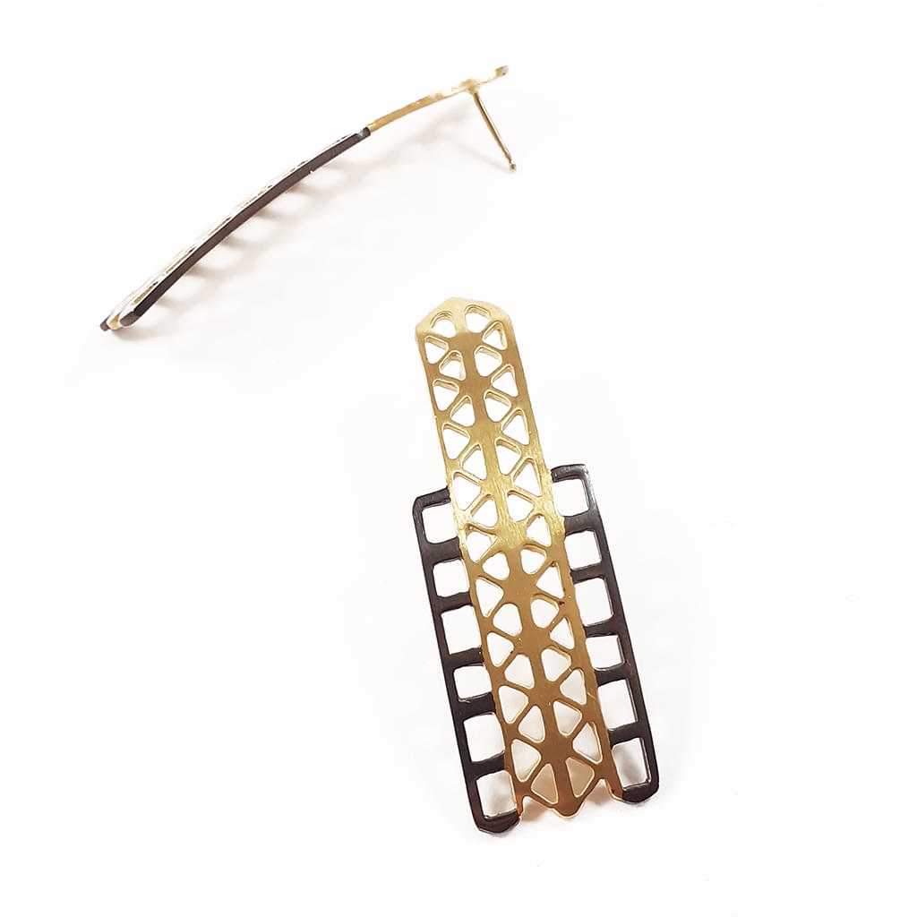 Katerina Malami. Simple earrings with geometric patterns in silver, gold plated and oxidized. Side view