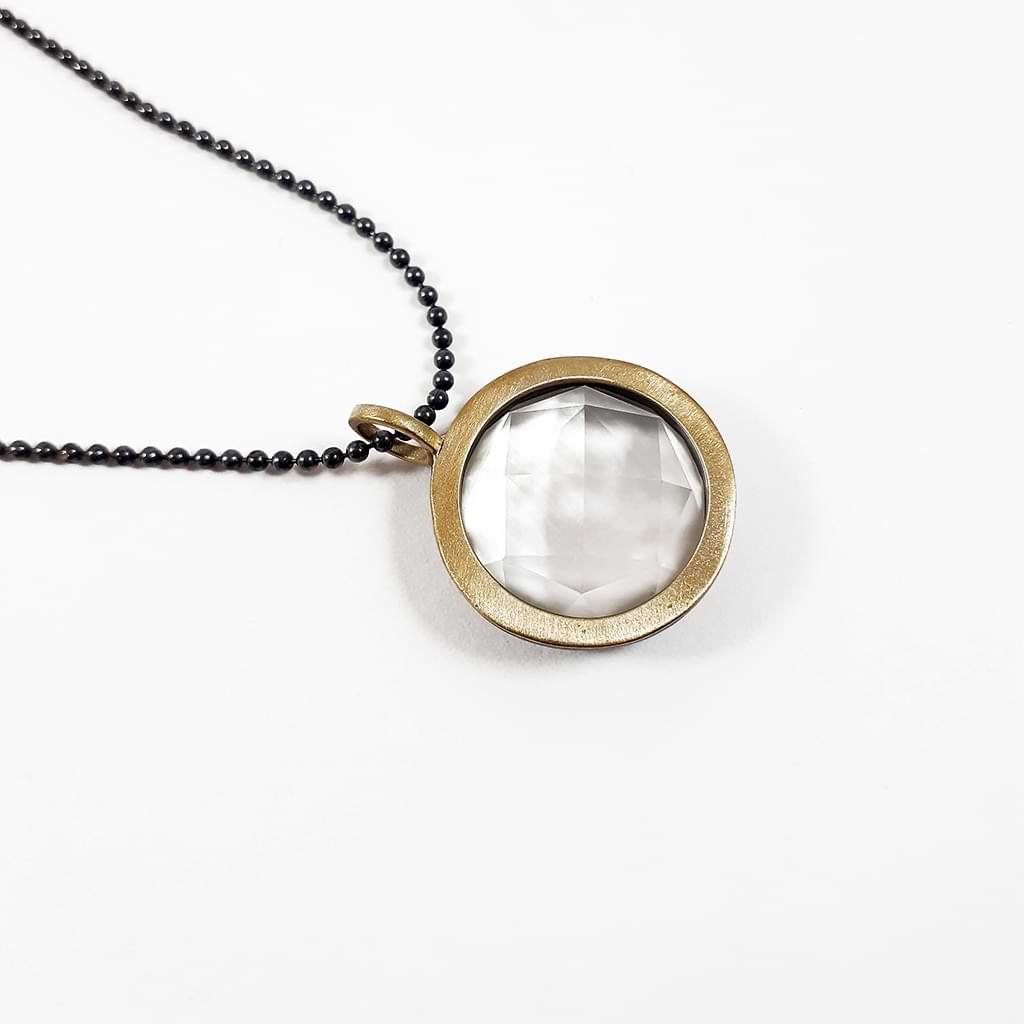 Niki Boli. Pendant with mother of pearl, crystal and gold.