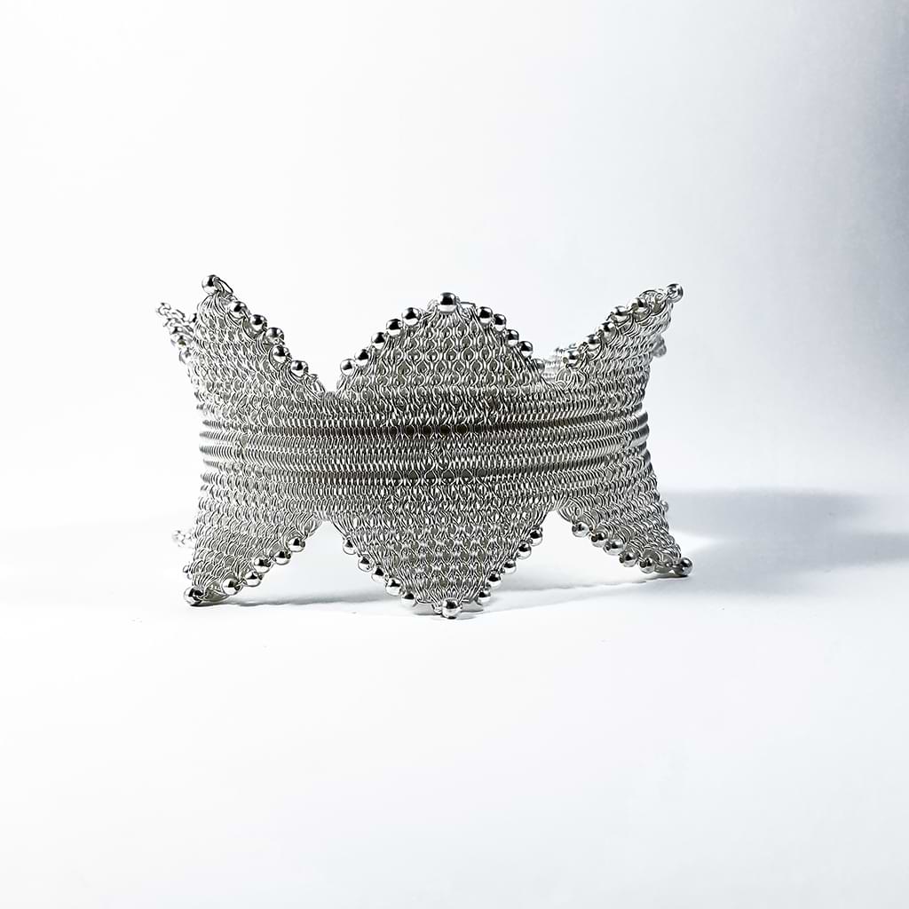 Myrsini Bezourgianni. Silver braided bracelet with spikes. Front view