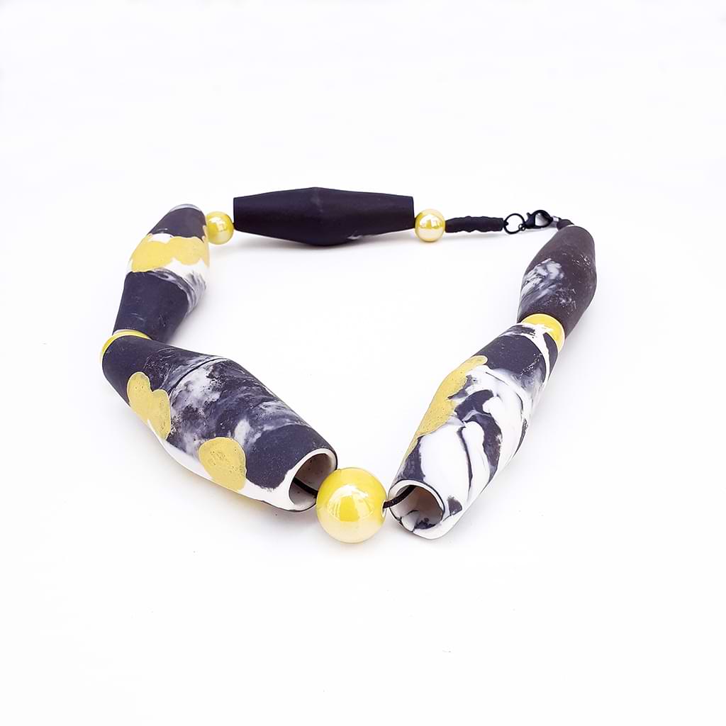 Angeliki Papadopoulou.Unique porcelain necklace with integrated pyrochromes inspired by the pasta of the Aegean.